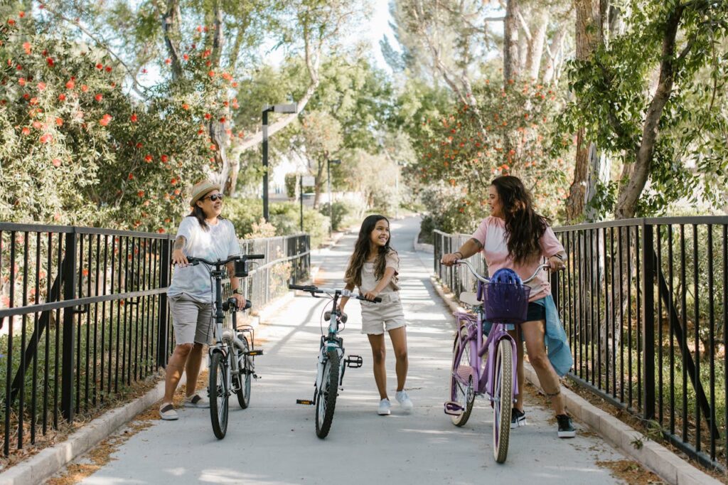 A joyful family biking together in a beautiful park, showcasing unity and fun.